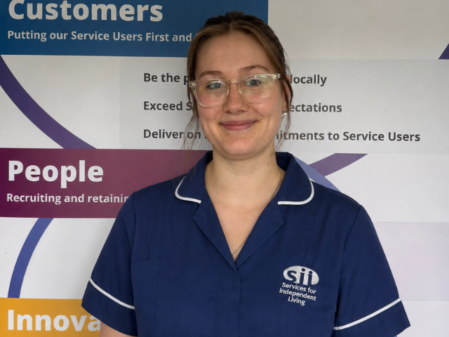Homecare worker in navy blue uniform and Services for Independent living logo