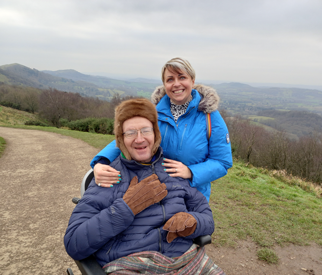 outdoor landscape with two people wrapped up against the cold