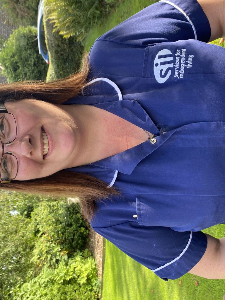 Homecare Support worker in blue uniform