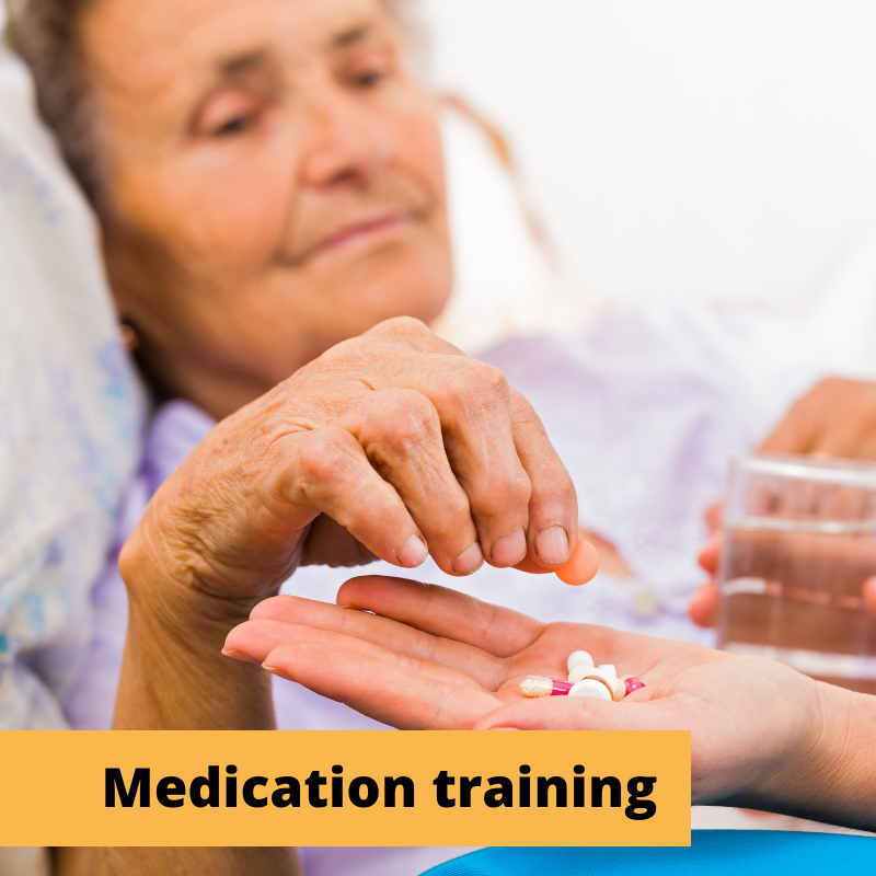 older woman reaches for medication being handed to her with a glass of water